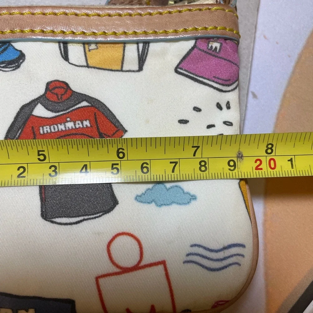 Dooney & Bourke Disney Sketch Marathon Wristlet 70.3 Run is a small wristlet